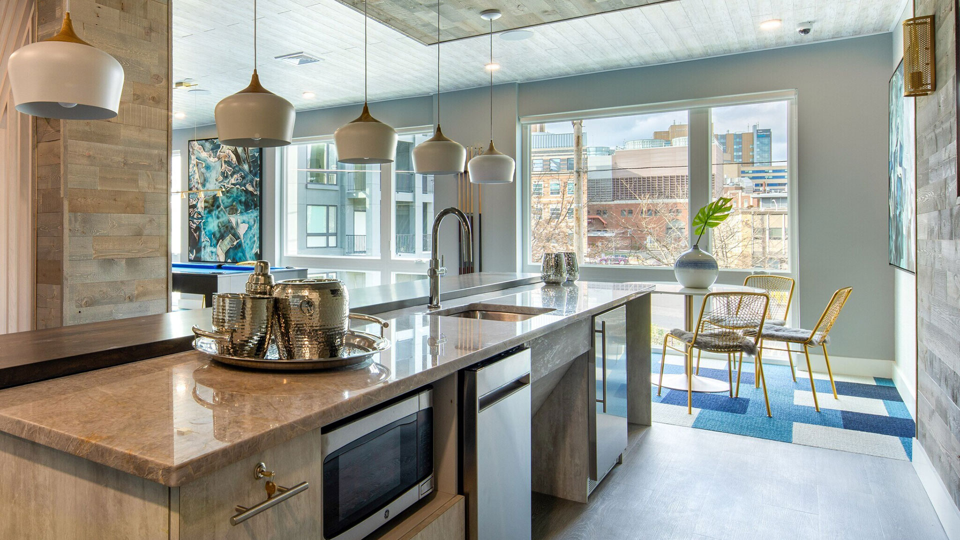 aura-explore-new Furnished kitchen and dining area